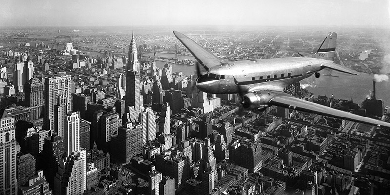 DC-4 over Manhattan
